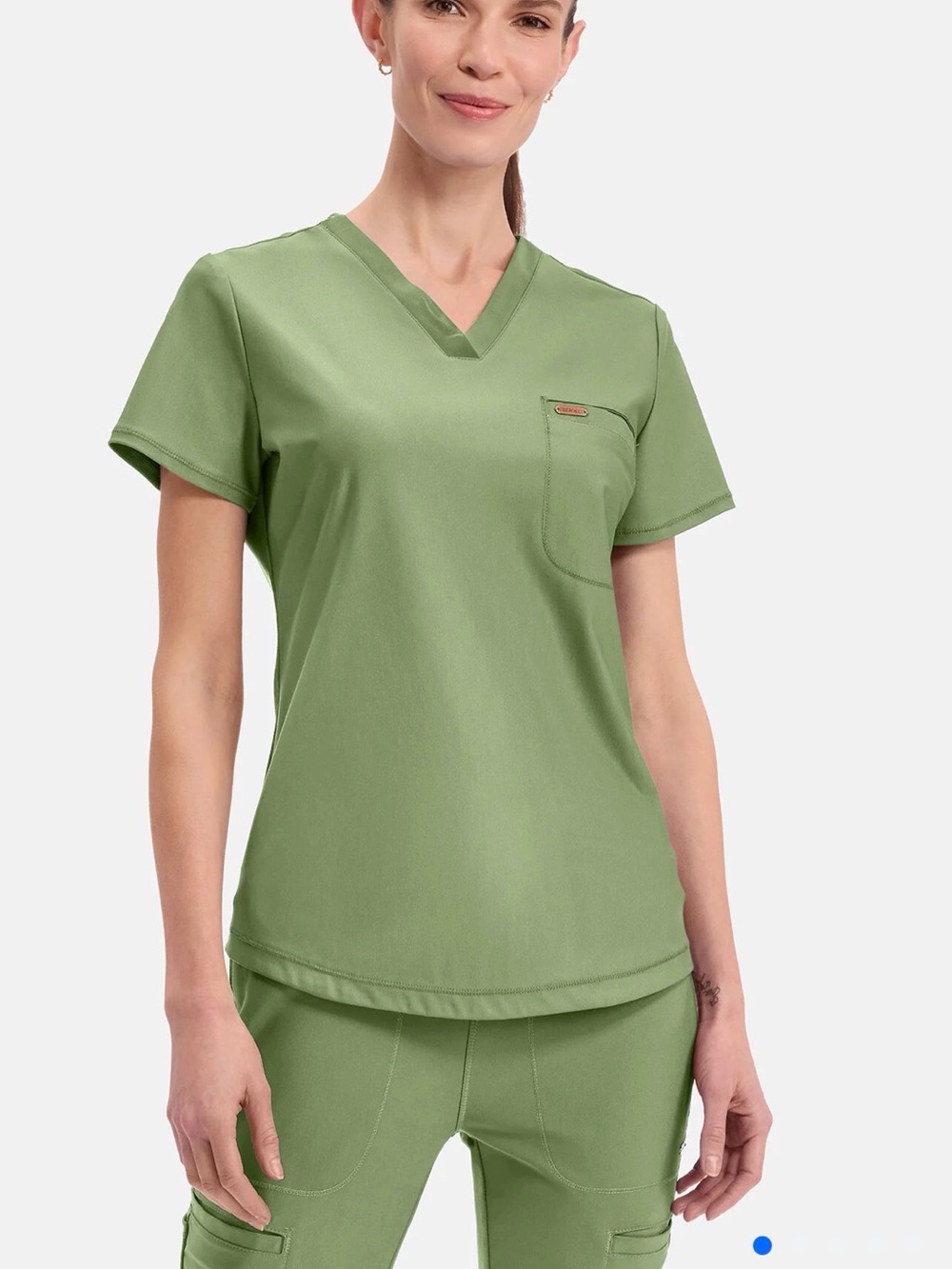 Cherokee FORM scrubs uniform in sage green.